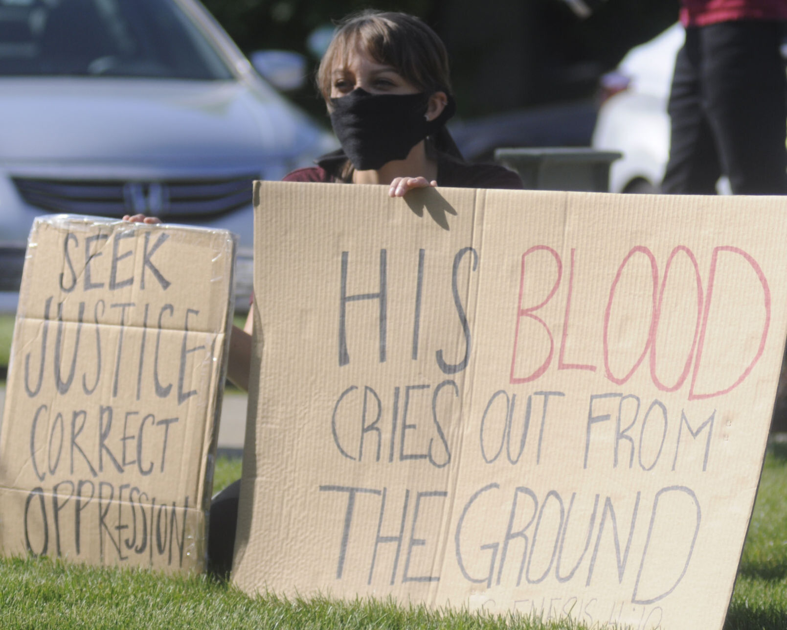 Protester holds signs